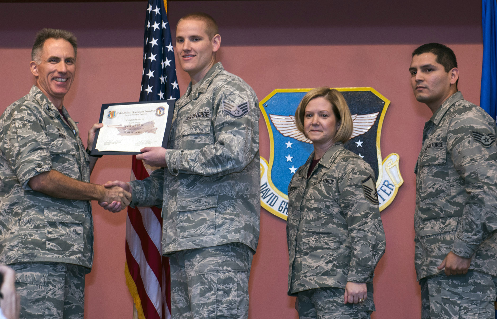 Photo Credit: Travis AFB CA: Col Michael Ross, Commander of the 60th Medical Operations Squadron presents Airman 1st Class Spencer Stone, 60th Medical Operations Squadron medical technician, with his regular promotion to senior airman at Travis Air Force Base, California, Oct. 30, 2015. Following his promotion, Stone was again promoted to the rank of staff sergeant by order of Air Force Chief of Staff Gen. Mark A. Welsh III. According to Air Force Instruction 36-502, the chief of staff of the Air Force has the authority to promote any enlisted member to the next higher grade. MSgt Tanya Hubbard and Staff Sgt. Roberto Davila, 60th Medical Group, tacked on Stone's new stripes during a group promotion ceremony at David Grant USAF Medical Center. Stone became the recipient of the rare honor following his heroic actions in August when he and two friends thwarted a potential terrorist attack on a train traveling to Paris. (U.S. Air Force photo by T.C. Perkins Jr.)